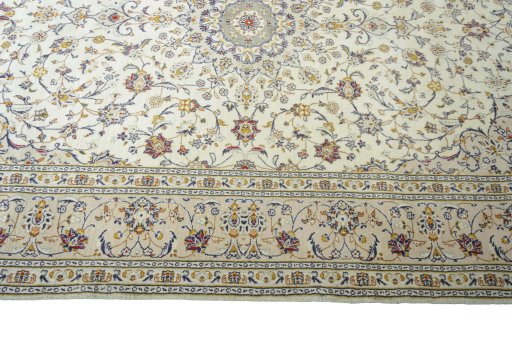 Corner detail of 2000s Kashan rug showing border pattern and Wool pile