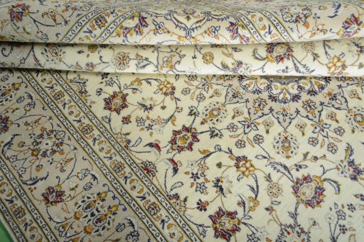 Close-up detail of 2000s Kashan rug from Iran / Persia showing Wool weave
