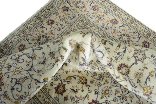 Surface texture of 2000s Kashan rug with natural Wool and intricate pattern