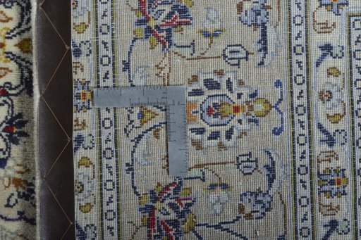 Backside of handmade 2000s Kashan rug showing knot structure and weave density