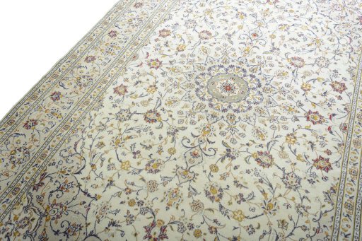 Backside of handmade 2000s Kashan rug showing knot structure and weave density