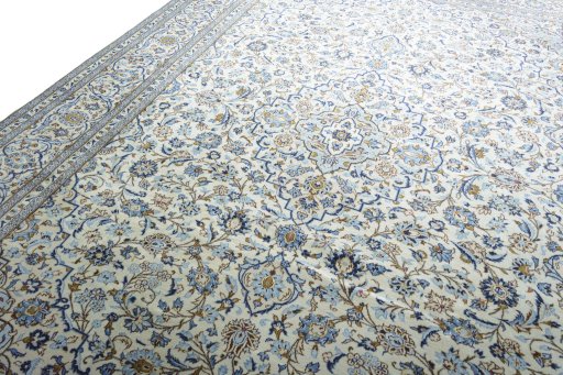 Backside of handmade 2000s Kashan rug showing knot structure and weave density