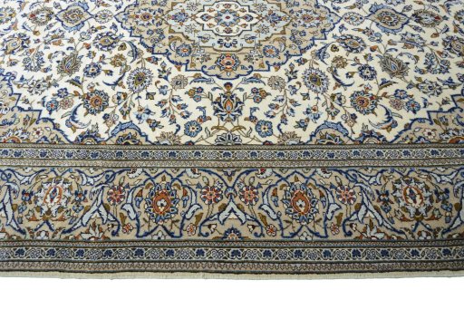 Corner detail of 2000s Kashan rug showing border pattern and Wool pile
