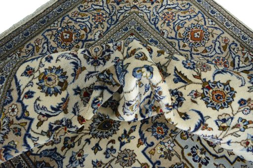 Surface texture of 2000s Kashan rug with natural Wool and intricate pattern