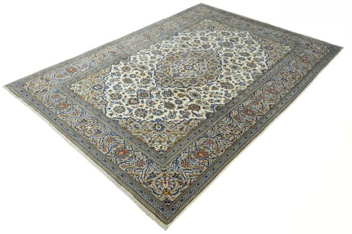 Corner detail of 2000s Kashan rug showing border pattern and Wool pile