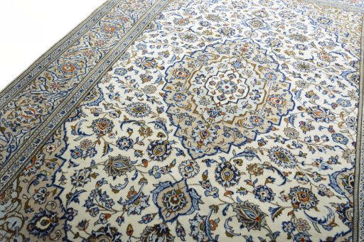 Backside of handmade 2000s Kashan rug showing knot structure and weave density