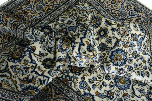 Surface texture of 2000s Kashan rug with natural Wool and intricate pattern