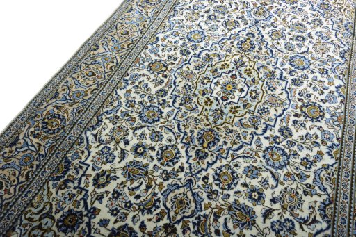 Backside of handmade 2000s Kashan rug showing knot structure and weave density
