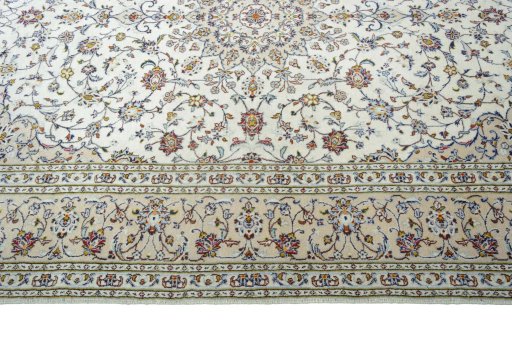 Corner detail of New Kashan rug showing border pattern and Wool pile