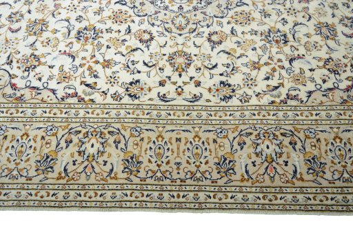 Corner detail of New Kashan rug showing border pattern and Wool pile