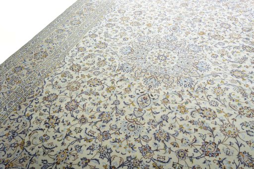 Backside of handmade 2000s Kashan rug showing knot structure and weave density