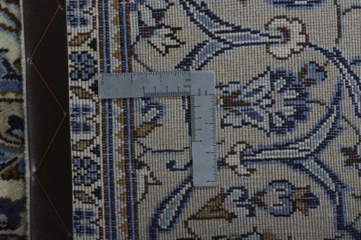 Backside of handmade 2000s Kashan rug showing knot structure and weave density