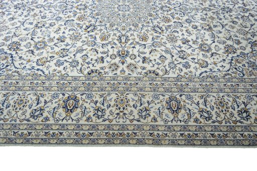 Corner detail of 2000s Kashan rug showing border pattern and Wool pile