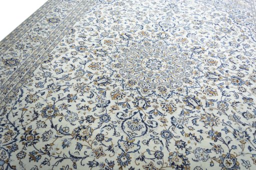Backside of handmade 2000s Kashan rug showing knot structure and weave density