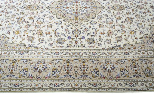 Corner detail of 2000s Kashan rug showing border pattern and Wool pile