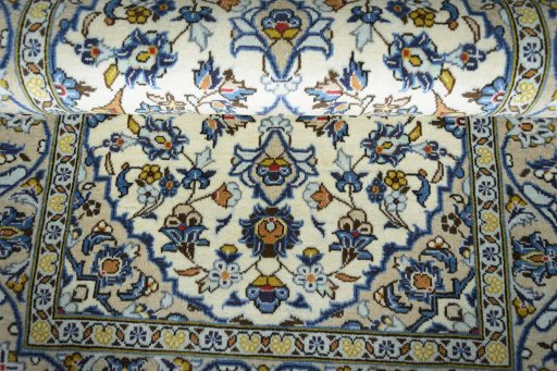 Close-up detail of 2000s Kashan rug from Iran / Persia showing Wool weave