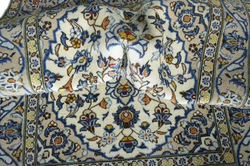 Surface texture of 2000s Kashan rug with natural Wool and intricate pattern