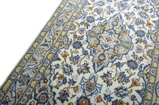 Backside of handmade 2000s Kashan rug showing knot structure and weave density