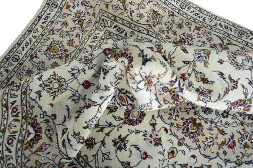 Surface texture of 2000s Kashan rug with natural Wool and intricate pattern