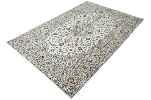Corner detail of 2000s Kashan rug showing border pattern and Wool pile
