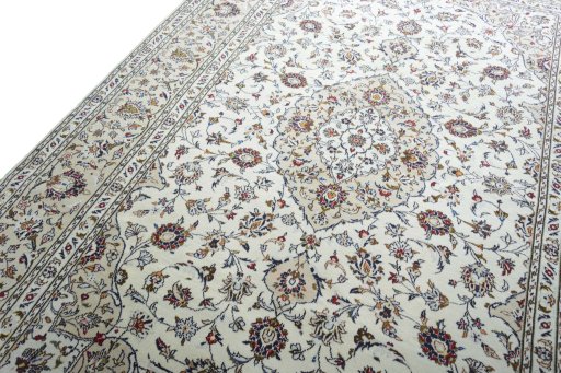 Backside of handmade 2000s Kashan rug showing knot structure and weave density