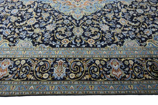 Corner detail of 2000s Kashan rug showing border pattern and Wool pile