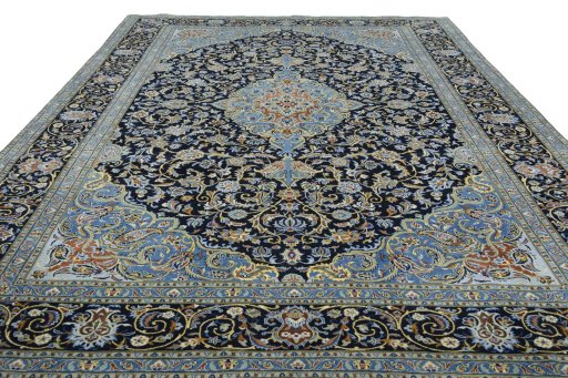 Surface texture of 2000s Kashan rug with natural Wool and intricate pattern
