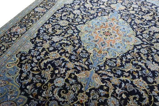 Backside of handmade 2000s Kashan rug showing knot structure and weave density