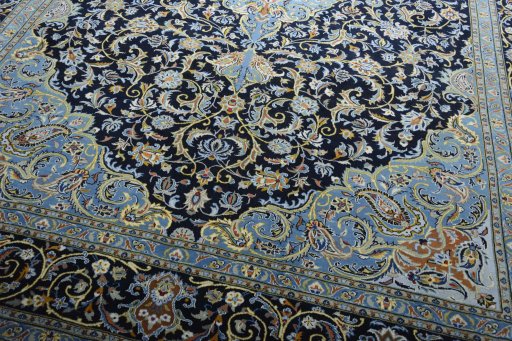 Close-up detail of 2000s Kashan rug from Iran / Persia showing Wool weave