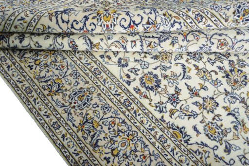 Close-up detail of 2000s Kashan rug from Iran / Persia showing Wool weave