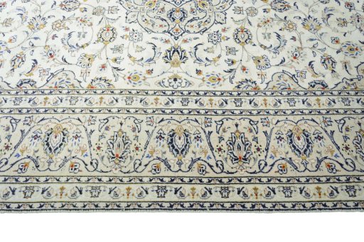 Corner detail of 2000s Kashan rug showing border pattern and Wool pile
