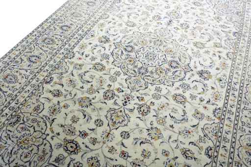 Backside of handmade 2000s Kashan rug showing knot structure and weave density