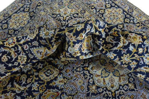 Surface texture of 2000s Kashan rug with natural Wool and intricate pattern