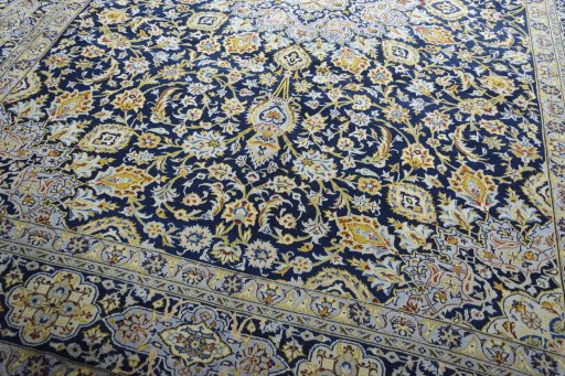 Close-up detail of 2000s Kashan rug from Iran / Persia showing Wool weave