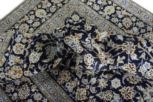 Surface texture of 2000s Kashan rug with natural Wool and intricate pattern