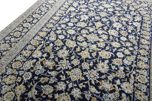 Backside of handmade 2000s Kashan rug showing knot structure and weave density