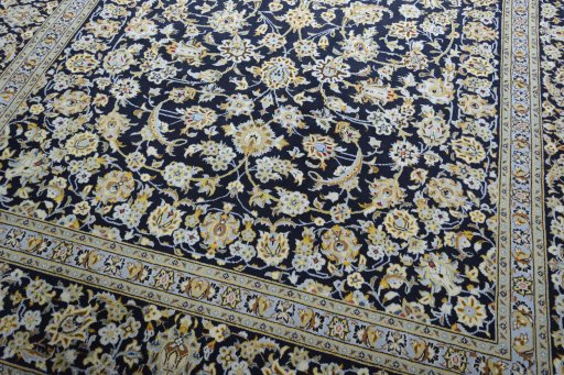 Close-up detail of 2000s Kashan rug from Iran / Persia showing Wool weave