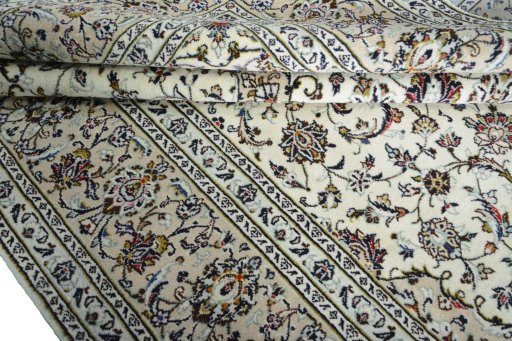 Close-up detail of 2000s Kashan rug from Iran / Persia showing Wool weave