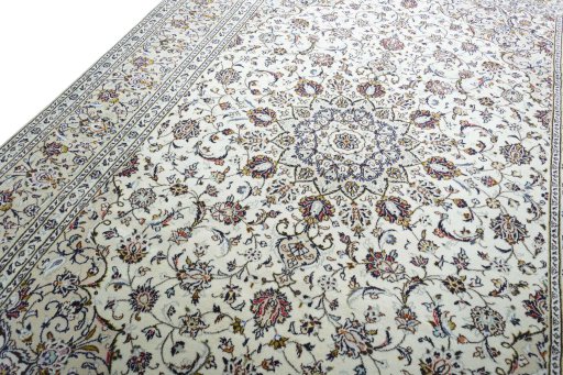 Backside of handmade 2000s Kashan rug showing knot structure and weave density