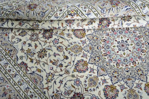 Close-up detail of 2000s Kashan rug from Iran / Persia showing Wool weave