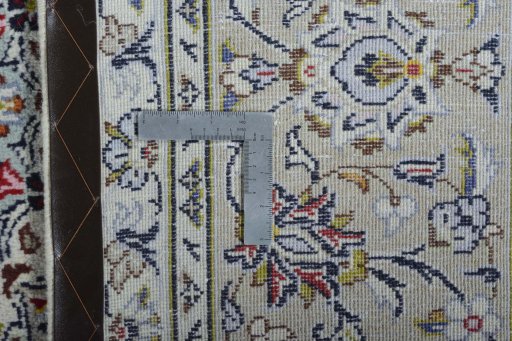 Backside of handmade 2000s Kashan rug showing knot structure and weave density