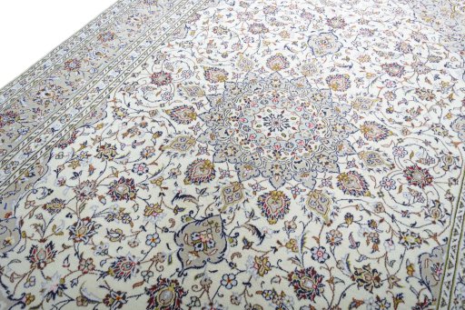 Backside of handmade 2000s Kashan rug showing knot structure and weave density