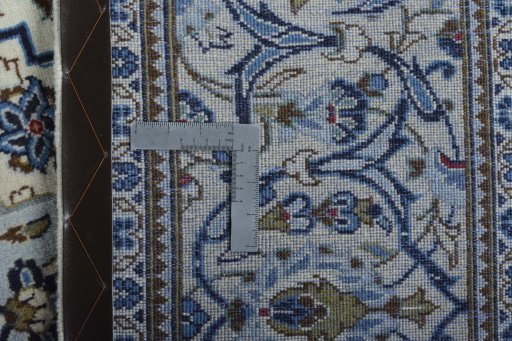 Backside of handmade 2000s Kashan rug showing knot structure and weave density