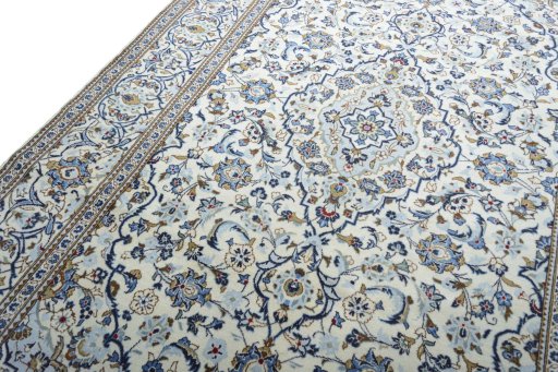 Backside of handmade 2000s Kashan rug showing knot structure and weave density