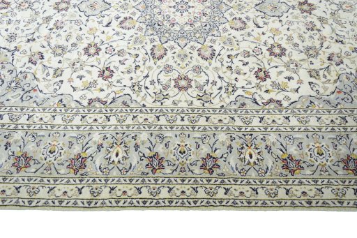 Corner detail of New Kashan rug showing border pattern and Wool pile