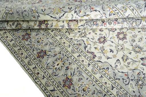 Close-up detail of New Kashan rug from Iran / Persia showing Wool weave