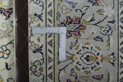 Backside of handmade New Kashan rug showing knot structure and weave density