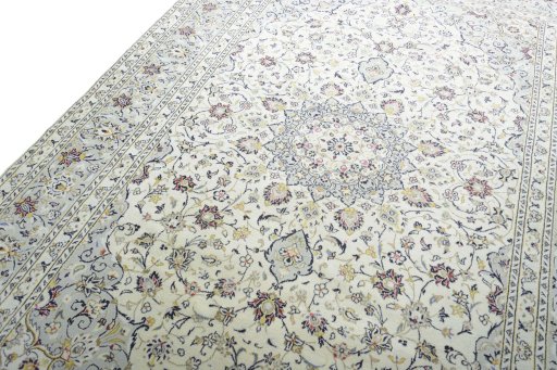 Backside of handmade New Kashan rug showing knot structure and weave density