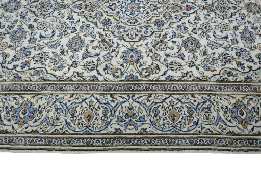 Corner detail of 2000s Kashan rug showing border pattern and Wool pile