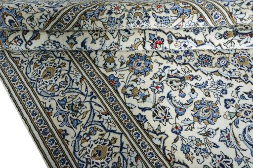 Close-up detail of 2000s Kashan rug from Iran / Persia showing Wool weave